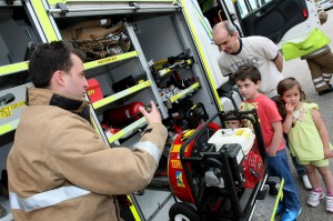Innes, Niamh and Orlaith Mitchell get shown around fire engine